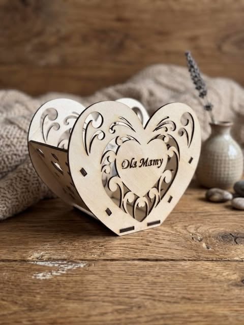 Wooden heart-shaped ornament with Oh Mamy engraved on center heart, displayed on rustic wood surface with decorative items