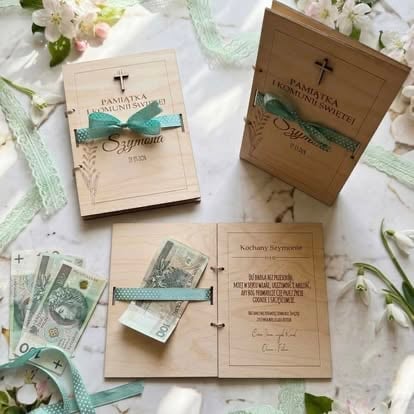 Wooden wedding invitation suite with teal ribbons and floral decorations on white background